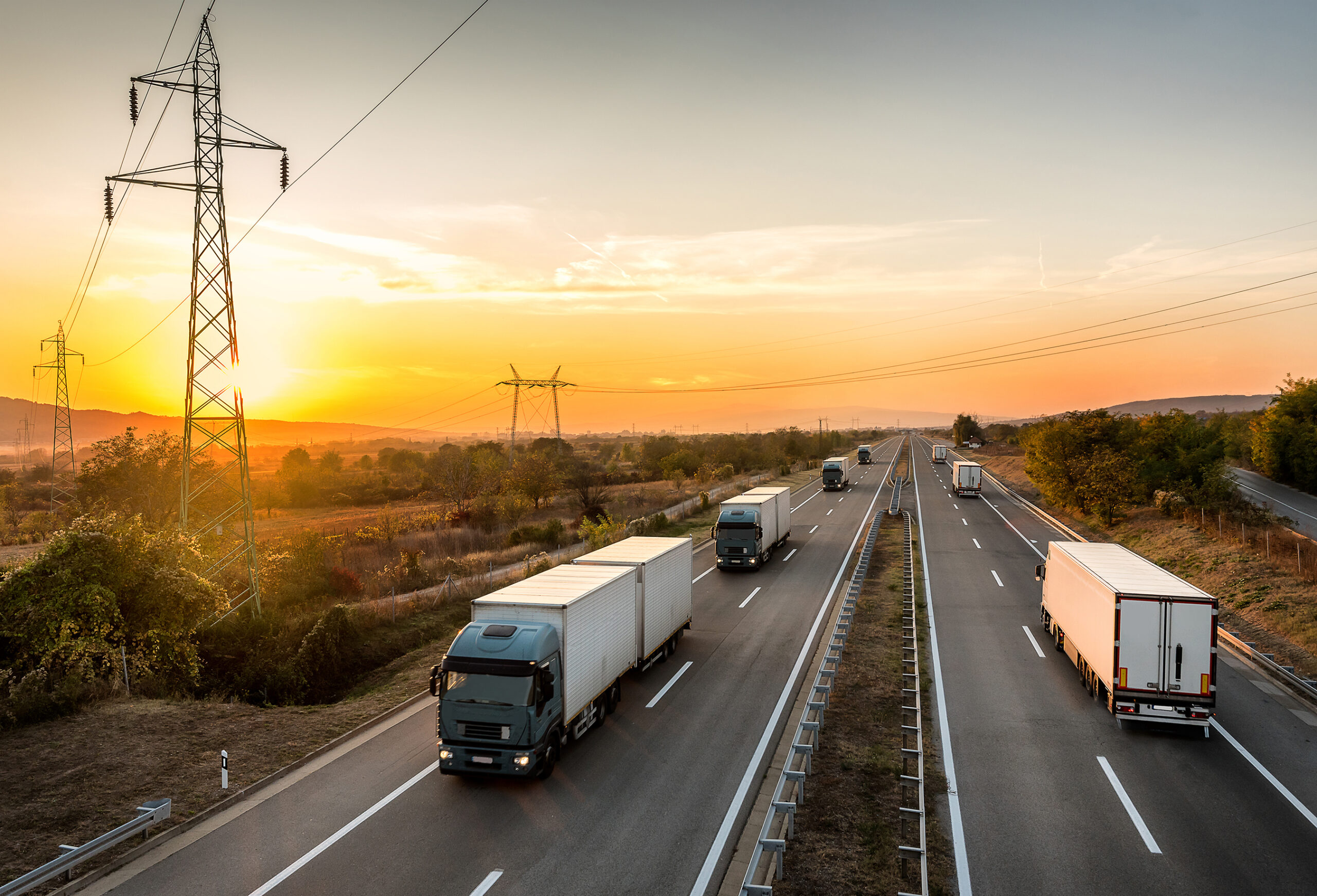 Lorry trucks passing each other on a highway